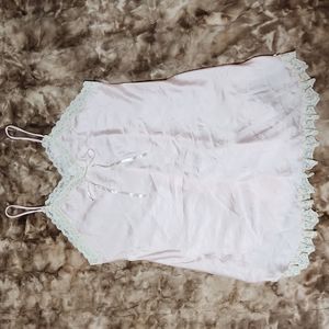 Women's pink night gown with cream colored lace.